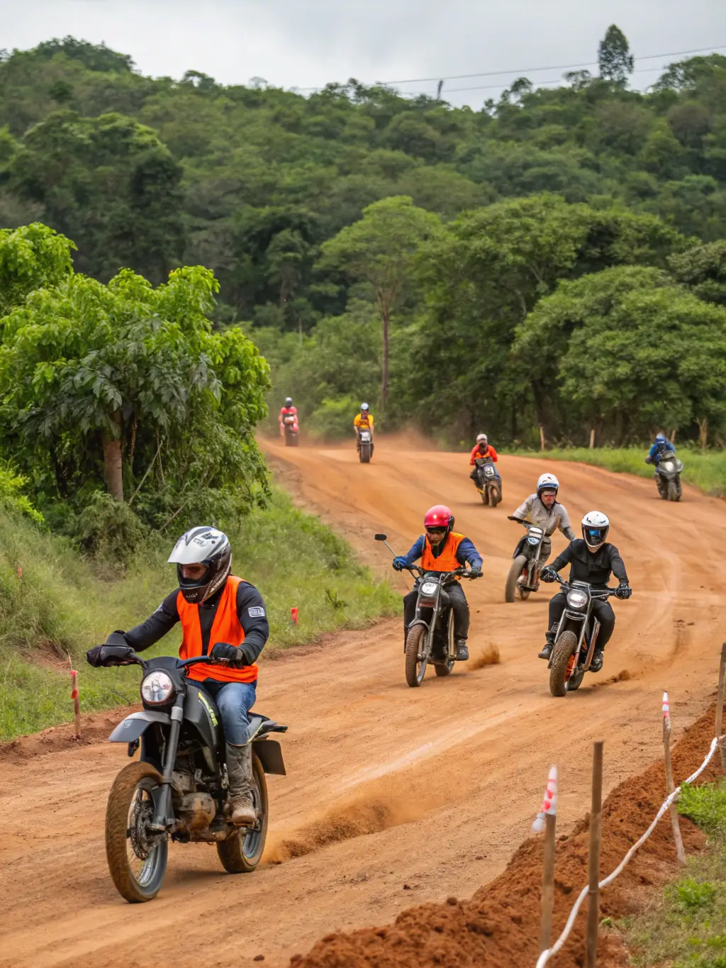 A group of young riders participating in a motocross training session at the LEYNHAC-MOTO-QUAD facility, showcasing skill development and responsible riding.